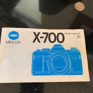 Minolta X-700 with Super Zoom Lenses, flash, etc. All paperwork.